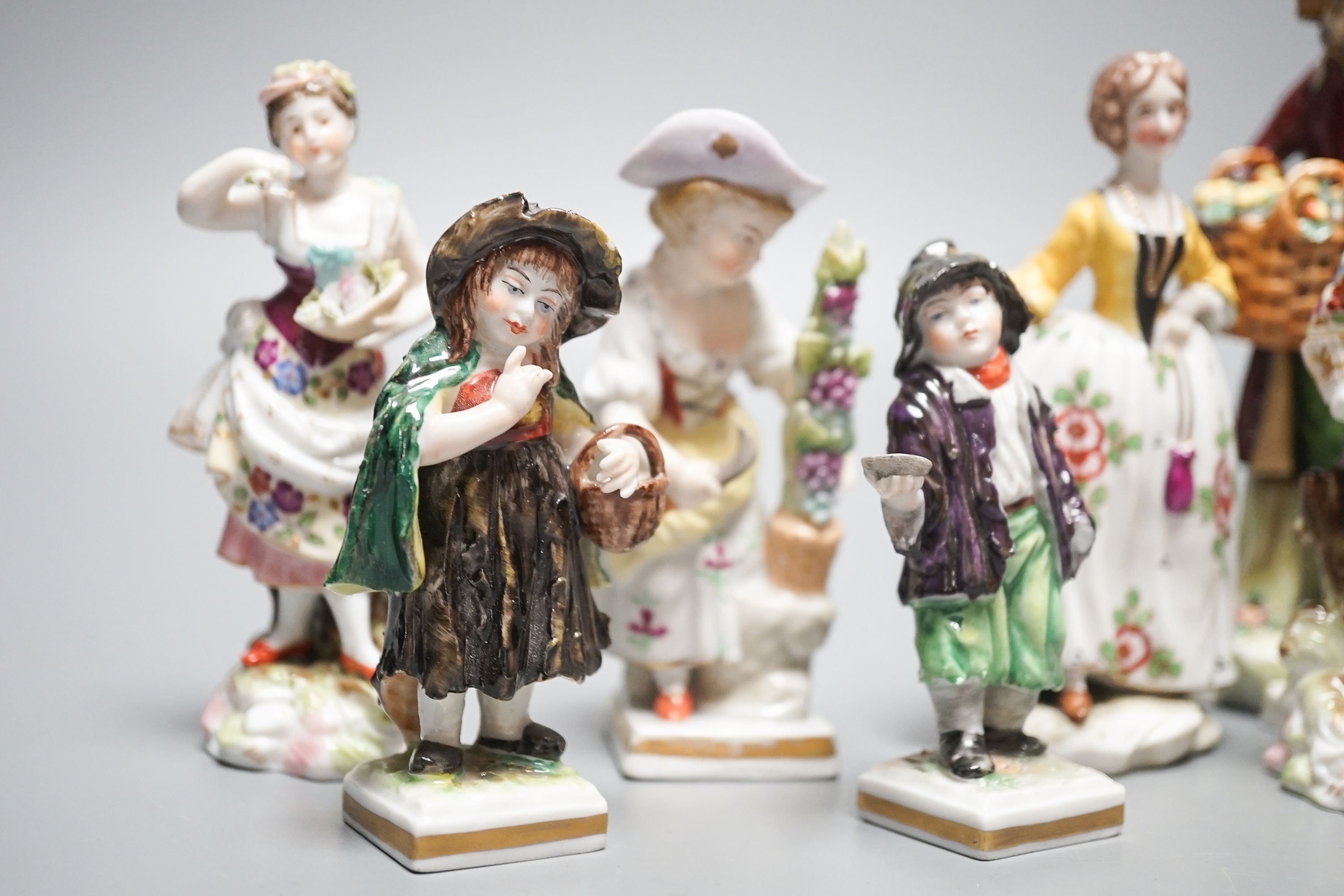 A collection of German porcelain figures, two by Sitzendorf, tallest 15.5 cm